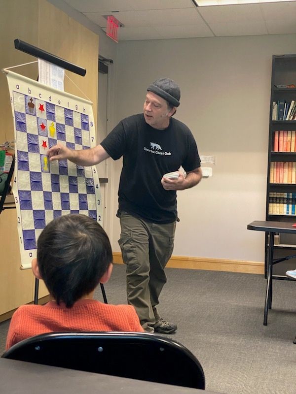Coach Tristen teaching chess tactics at Clever Fox Chess Club Coach Tristen teaching chess tactics at Clever Fox Chess Club